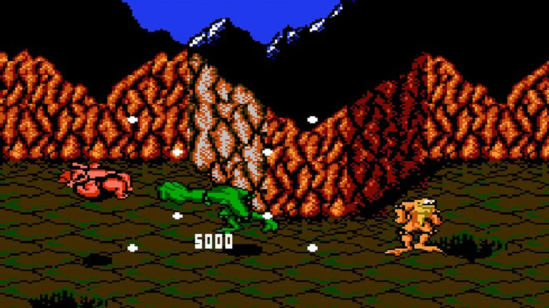 Rash golpea a un enemigo mientras Zitz está presente en Battletoads (1991)
